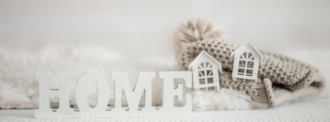 Background with Wooden inscription home. Decorative letters forming word HOME.