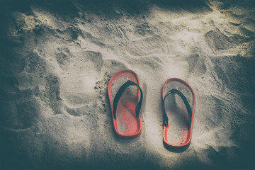 Red shoes on the beach on daylight