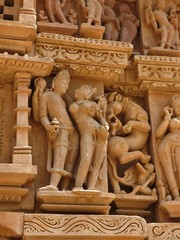 Sex poses from the kamasutra, erotic close - up of intricate carved scenes on the walls of Hindu...