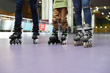 Family at roller skating rink, closeup view