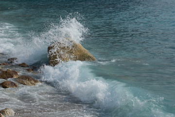 Sea storm, the wave is breaking on the pier