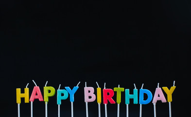  Birthday candles - words on a black background.