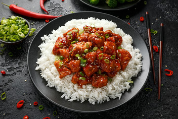 Tso's chicken with rice, green onion and broccoli