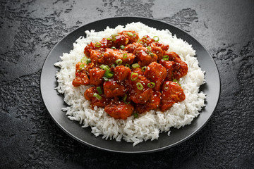 Tso's chicken with rice, green onion and broccoli