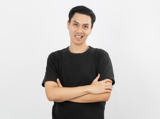 Young handsome asian man smiling with braces and looking at camera with arms crossed isolated on...