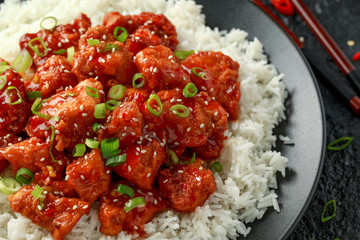 Tso's chicken with rice, green onion and broccoli