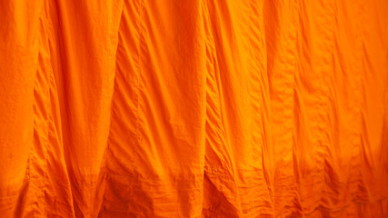 Yellow robe (of a Buddhist monk or novice); any of the three garments of the monk. The upper inner robe. Sarong, Yellow Fabric background / texture.