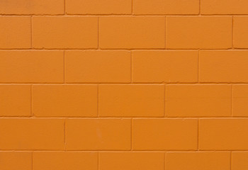 orange painted brick wall texture and background - image