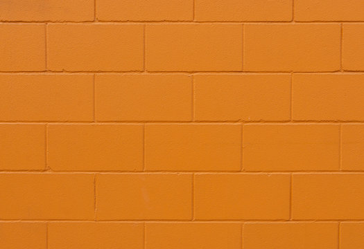 orange painted brick wall texture and background - image © Miquel