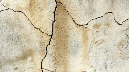  A crack on the concrete wall surface of a house in Los Angeles. Background image for design