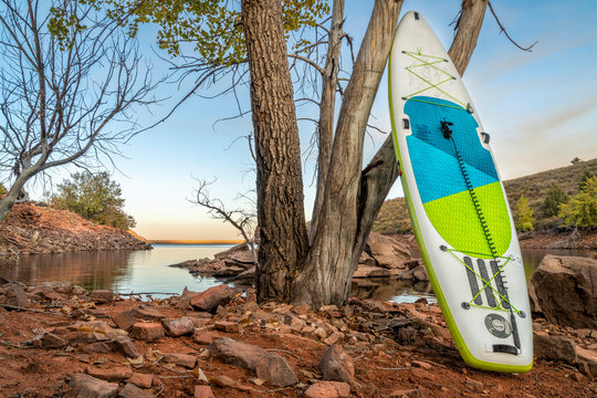 Inflatable Stand Up Paddleboard  On Mountain Lake