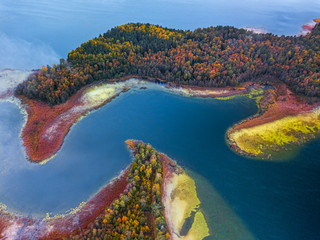 Aerial view over the lake with capes and bendings