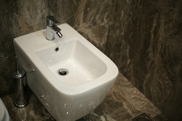 Fototapeta premium Toilet and bide bathroom isolated on black background.