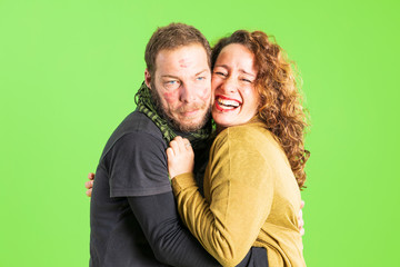 Beautiful young couple in love, kissing, throwing kisses with their hands. Romantic relationship.