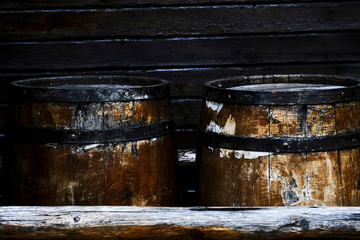 old wooden barrels for storing alcoholic beverages