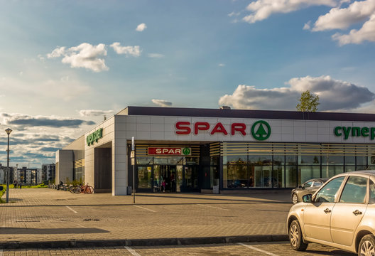 Family supermarket building SPAR in city in summer