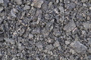 Crushed stone texture, gray broken stone for construction