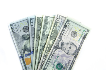 American dollars denominations of one hundred, fifty, five. Arranged in a chaotic manner, a short flight of stairs, a bill on a bill. Old sample and new notes. Dollars in hands are twisted into a tube