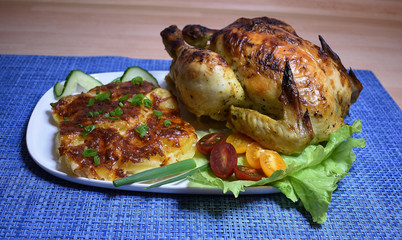 Baked chicken with potatoes and greens