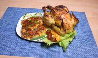 Baked chicken with potatoes and greens