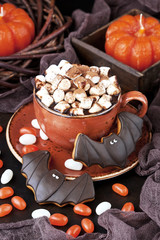 Halloween  time composition with cookies and hot chocolate mug