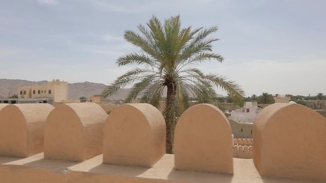 Nizwa Fort, Oman. Traditional Omani fortress, general plan and details. Camera movement along the corridor on the fortress wall.