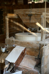 Wooden gender millstones to make flour.