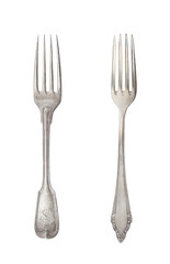 Beautiful old vintage forks isolated on white background. Top view. Retro silverware.