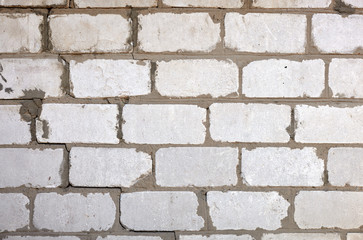 Texture, brick, wall, it can be used as a background . Brick texture with scratches and cracks