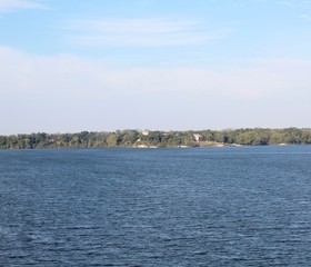 The calm beautiful view of the lake on a sunny day.