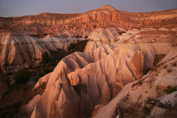 Beautiful panoramic view of pink valley  in Cappadocia. Free lifestyle. Cappadocia region of Turkey, Asia. Traveling concept background.