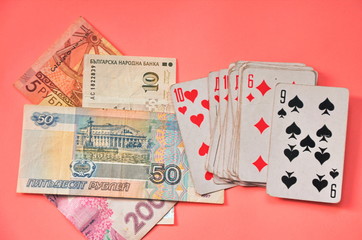 Image of the playing cards with the russian roubles banknote background.