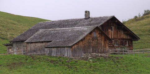 Fototapeta na wymiar Rural wooden houses in the Alps