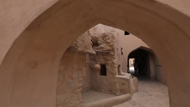 Nizwa Fort, Oman. Traditional Omani fortress, general plan and details. Camera movement along the corridor on the fortress wall.