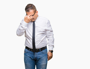 Middle age bussines arab man wearing glasses over isolated background tired rubbing nose and eyes feeling fatigue and headache. Stress and frustration concept.