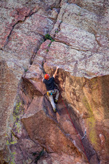 rock climber on top of mountain