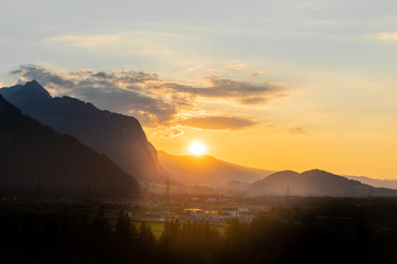 Fototapeta na wymiar Sunset by the mountains in switzerland