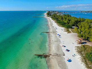 Aerial view of Coquina Beach white sand beach and turquoise water in Bradenton Beach during blue...