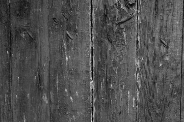 Black and white wooden boarded wall with cracked paint background