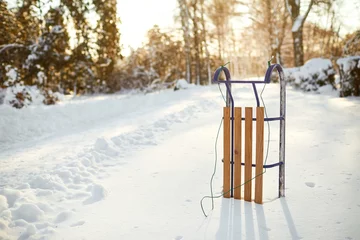 Fotobehang Winter sled in the snow in the winter park © Studio Romantic