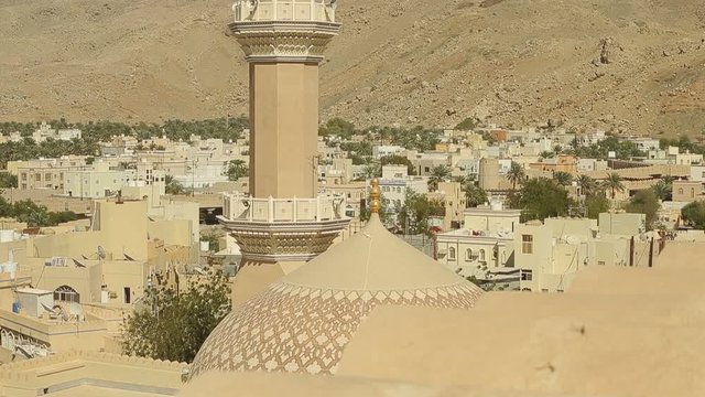 Nizwa Fort, Oman. Traditional Omani fortress, general plan and details. Panorama of the minaret