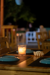 Candle lanterns on restaurant tables