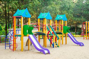Colorful children playground activities in public park. Safe modern children's playground