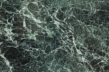 Fototapeta premium The dark green marble. Facing stone. Texture
