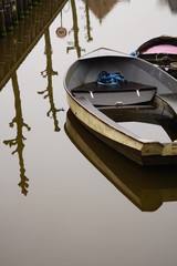 Fototapeta na wymiar Boats on a Canal in Harlingen, Netherlands