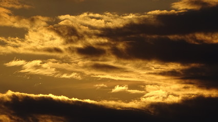 Naklejka na ściany i meble Sky full of clouds with some sun rays. Heaven sky. Background photography