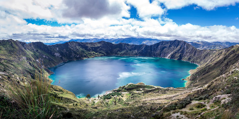 Naklejka na ściany i meble Panoramic view of a lake within a volcano crater named Quilotoa. South America, Ecuador