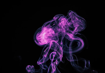 Colored blue smoke on a black background. Trendy color of the year 2022