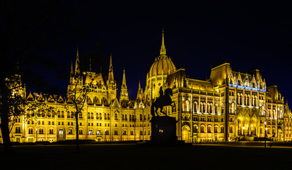 Parliament is the most beautiful building in Budapest and the largest in Hungary. Embankment with palaces and residences in the lights. Architectural Style - Neo-Gothic
