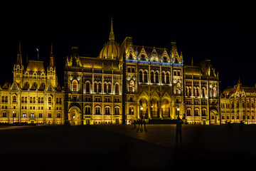 Fototapeta na wymiar Parliament is the most beautiful building in Budapest and the largest in Hungary. Embankment with palaces and residences in the lights. Architectural Style - Neo-Gothic